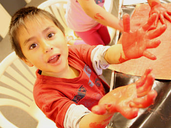 ARTWORKSHOPboywithpaintedhands